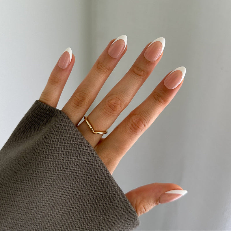 Hand wearing press on nails