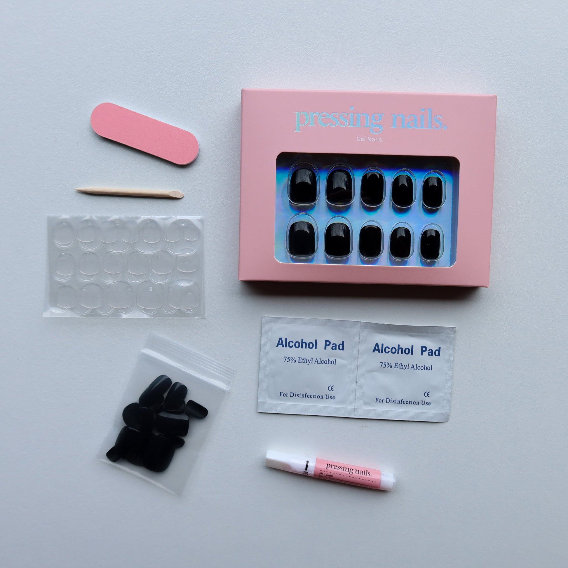 Black extra short Press on nail kit with everything that is included in the pack