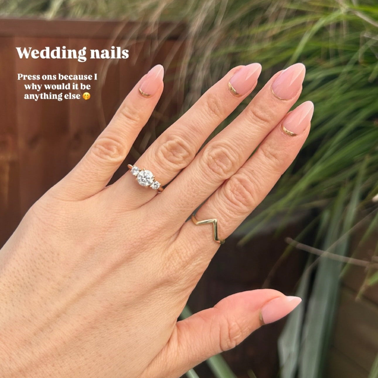 hand wearing press on nails with text saying weddingnails 