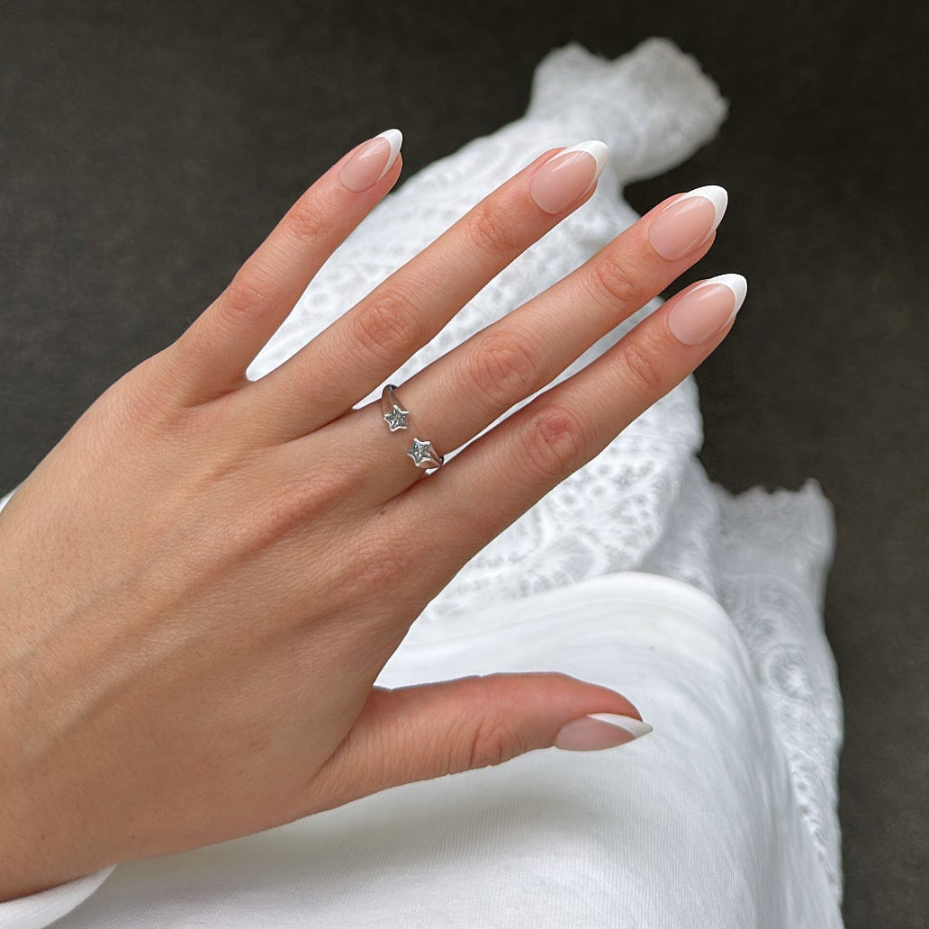 Hand with white tip press on nails 